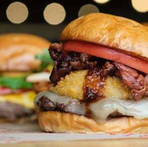 three burgers front with onion & bbq sauce 